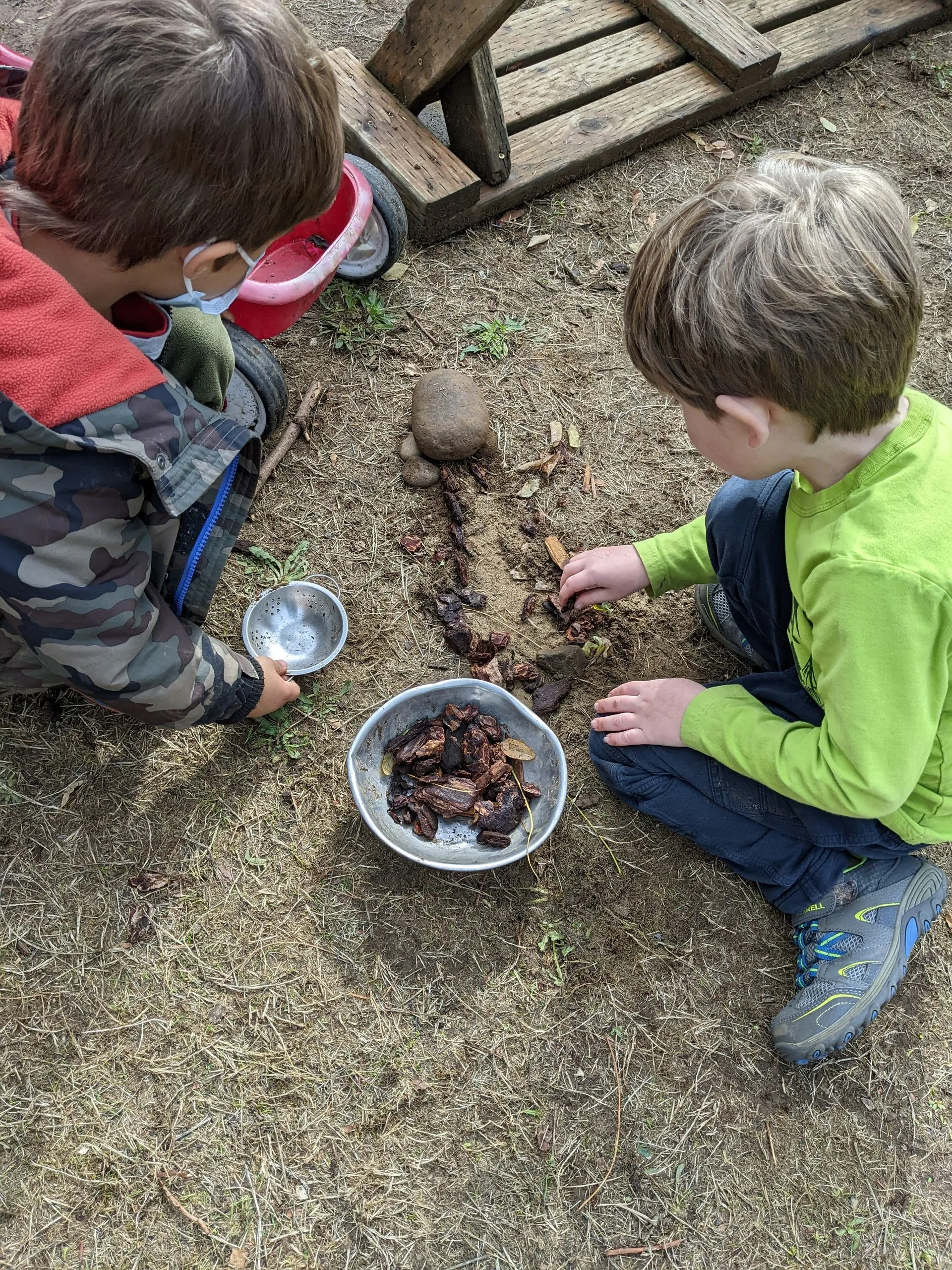 A chld gardening with a Montessori guide